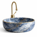 Vasque ronde marbre bleu avec finition bord dor